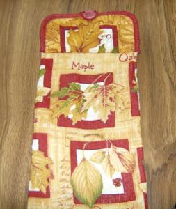 Potholder topped kitchen towel.