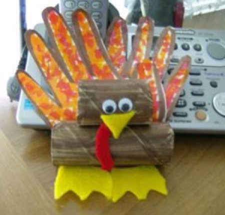 A paper turkey craft made from a child's handprints.