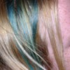 Green streaks in blond hair.