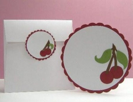 Round card and tag with cherry motif.