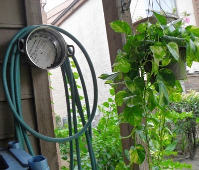 cooking pot as hose hanger