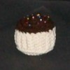 Crochet pin cushion in the shape of a cupcake.