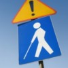 caution sign, blind person walking with a cane