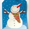 gift tag with snowman made from recycled paint chips, ribbon, and paint
