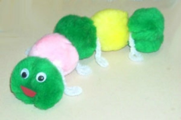 White, green, and yellow pom pom caterpillar.