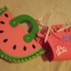 Craft foam purses, a watermelon and a crown.