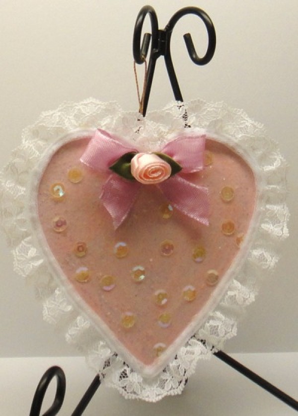 Lace edged pink heart ornament.
