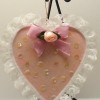 Lace edged pink heart ornament.