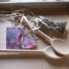 Spoons on wooden tray.