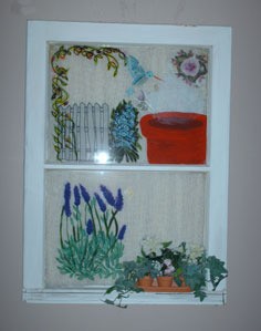 Decorated and painted old window wall hanging.