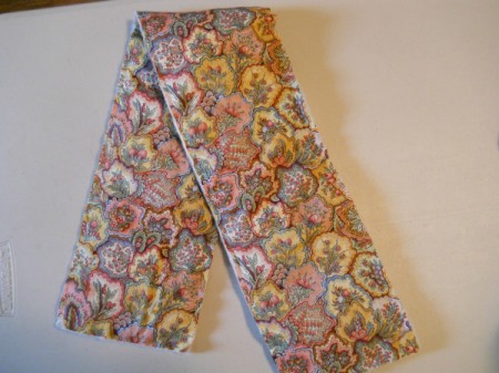 Sandwiched fabric and batting crossover  strip.