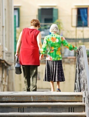 Elderly Woman Walking with Daughter