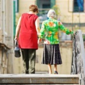 Elderly Woman Walking with Daughter