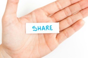 A hand with a  note that says "share".