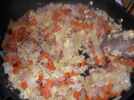Add the onions, carrots, and ham back to rice.