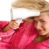 girl blow drying her hair