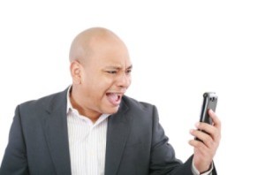 A man looking at his cell phone.