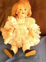 Doll in ruffly dress.