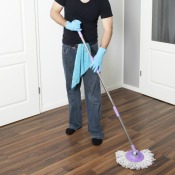 Man Removing Wax From Laminate Flooring