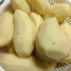 Peeled potatoes in colander.