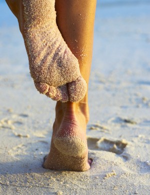 On the beach scratching fleas.