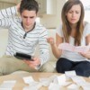 A girlfriend and boyfriend struggling to pay bills.