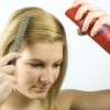 Woman Applying Hair Spray