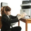 Woman Fixing a Printer That Won't Print
