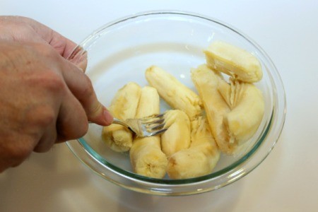 mashing banana with fork