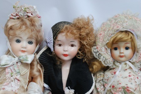 Photo of 3 vintage porcelain dolls.