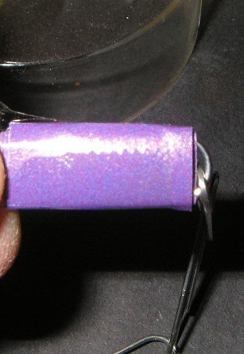 Closeup of paper wrapped clip with tape..