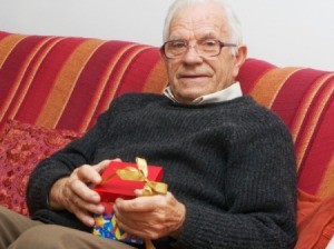 elderly man with a gift