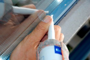 applying adhesive on a window