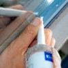 applying adhesive on a window