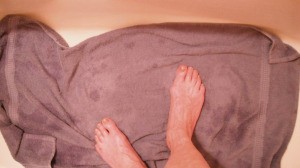 Bathtowel on floor of tub.