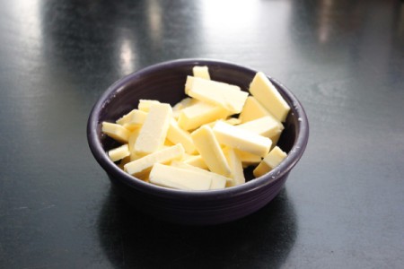 Cut up pieces of cold butter.