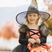 Girl in a witch costume.