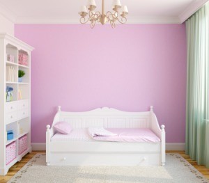 Nursery with pink walls.