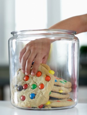 Large cookies in a cookie jar.