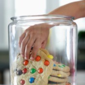 Large cookies in a cookie jar.