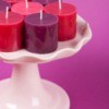 Candles on a cake stand.