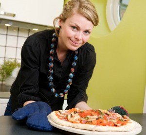 Baking a pizza on a baking stone.