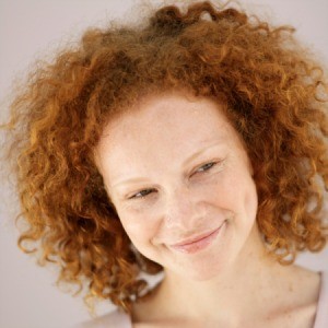 Girl with red curly hair.