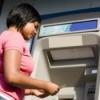 Woman Getting Money from Cash Machine