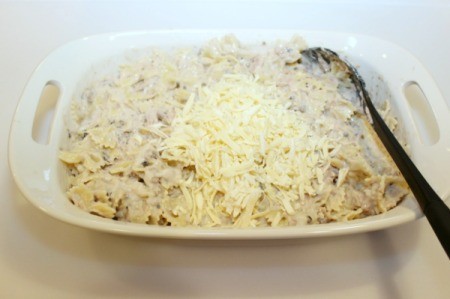 adding grated cheese