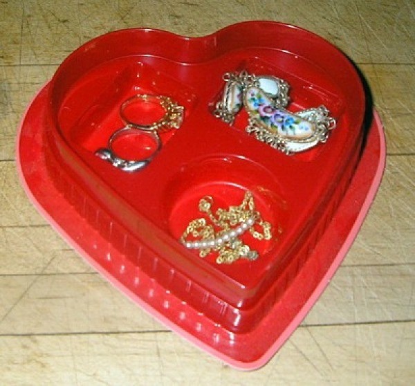 Plastic candy box insert for holding jewelry.