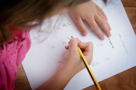 A girl working on a math.