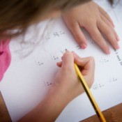 A girl working on a math.