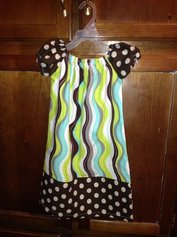 Cap sleeve dress with polka dot sleeves and bottom.