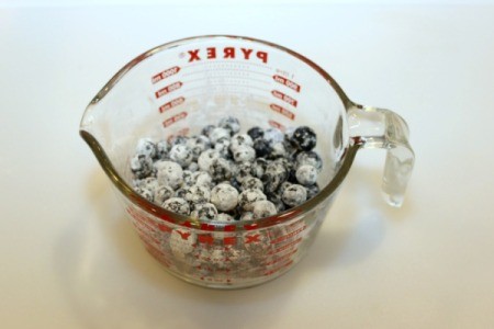 coat blueberries in flour